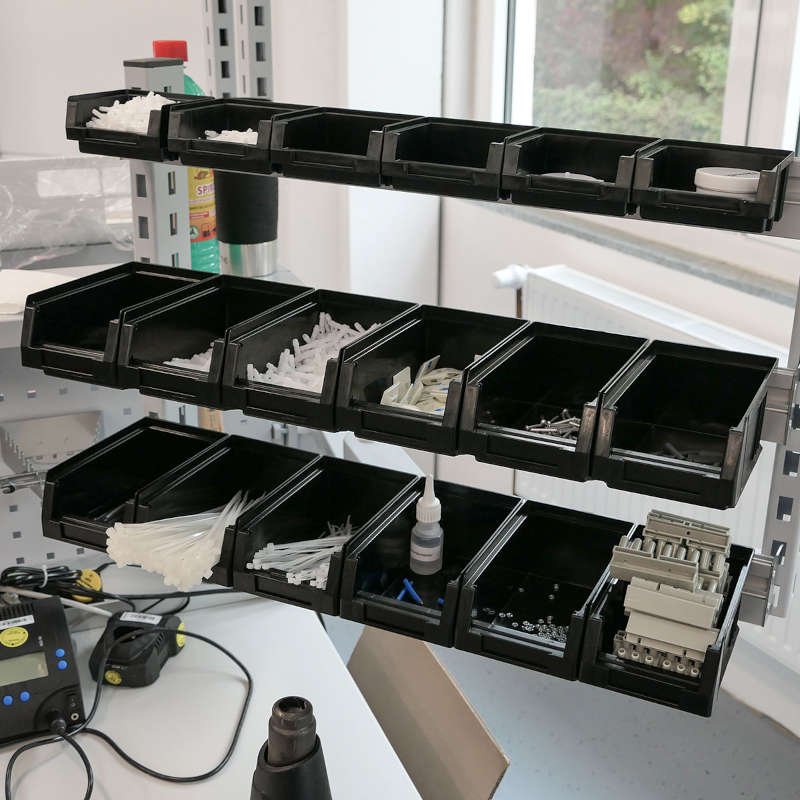 OTTOKIND workstation with integrated storage bins and tool organization